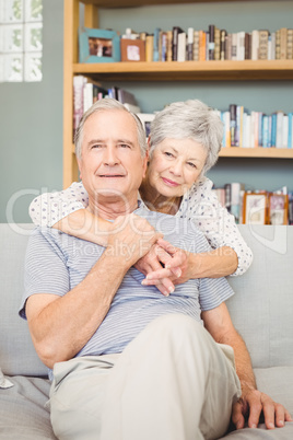 Happy romantic senior couple in living room