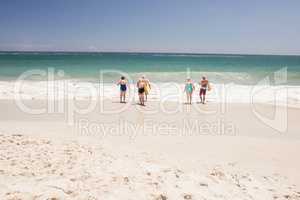 Senior friends holding surfboard