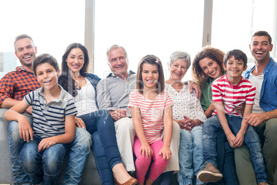 Happy family sitting on sofa