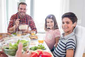 Happy family having breakfast