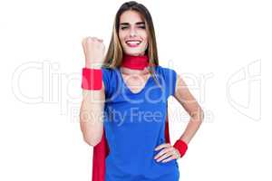 Portrait of cheerful woman in superhero costume while standing