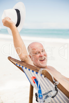 Senior man holding his sunhat