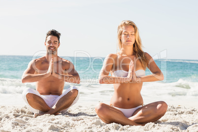 Happy couple doing yoga