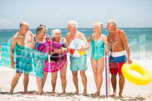 Seniors standing in a row at the beach