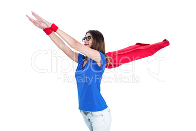Woman in superhero costume pretending to fly