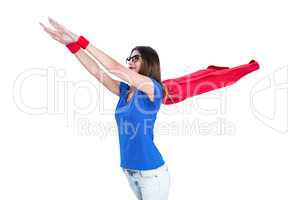 Woman in superhero costume pretending to fly