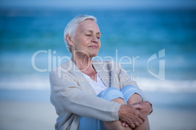 Thoughtful mature woman day dreaming