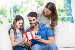Family looking at gift