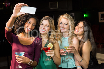Happy friends taking a selfie