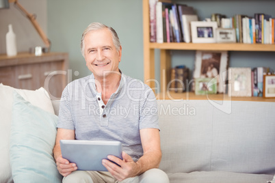 Portrait of senior man using digital tablet Portrait of senior man using digital tablet