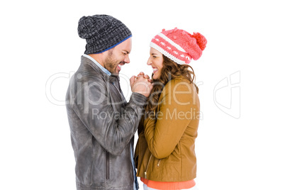 Young couple in warm cloth standing face to face and shivering