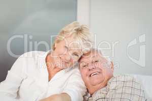 Happy senior couple in bed