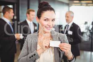 Businesswoman showing her badge