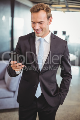 Businessman looking at mobile phone Businessman looking at mobile phone