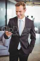 Businessman looking at mobile phone