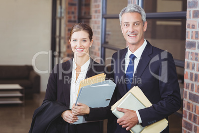 Happy business people with files