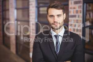 Portrait of confident businessman standing in office