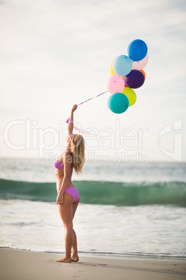 Beautiful woman holding balloon