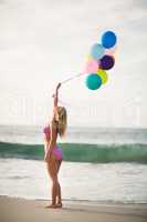 Beautiful woman holding balloon