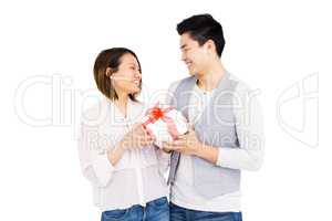 Young man giving a present to woman