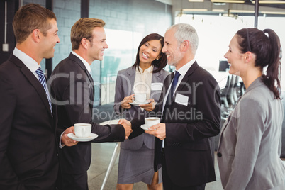 Businesspeople having a discussion during break time