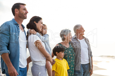 Happy family posing at the beach