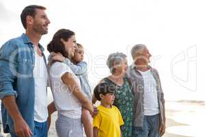 Happy family posing at the beach