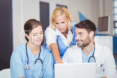 Doctor team using laptop
