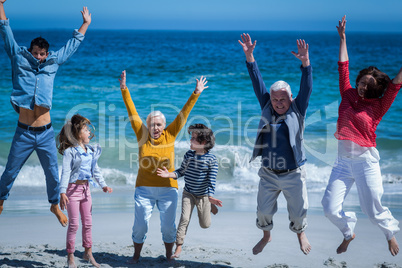 Happy smiling family jumping together