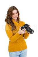 Young woman using camera