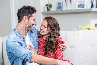 Smiling couple embracing