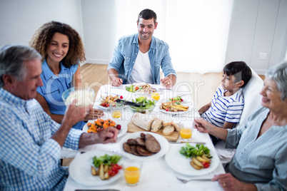 Happy family having breakfast together