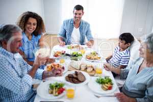 Happy family having breakfast together