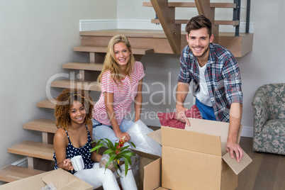 Happy friends relocating at new house