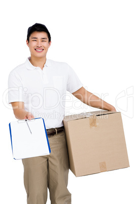 Delivery man with cardboard box and clipboard