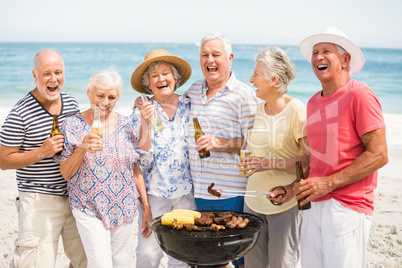 Senior having a barbecue on the beach