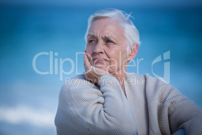 Thoughtful mature woman looking away