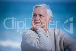 Thoughtful mature woman looking away