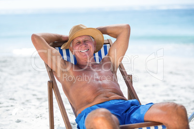 Mature man relaxing on a deck chair