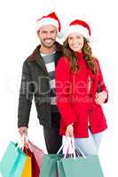 Happy young couple holding shopping bags