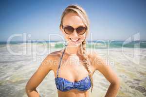 Portrait of happy woman standing on the beach