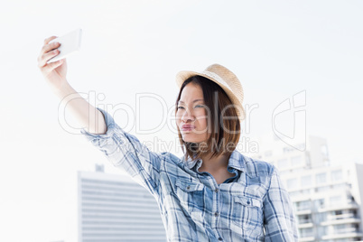 Young woman taking a selfie