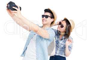 Happy young couple clicking a picture