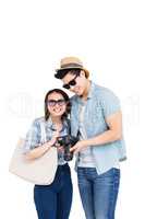 Happy young couple with a camera