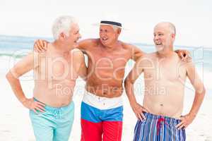 Senior men standing at the beach
