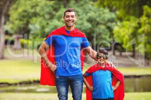 Father and son in superhero costume