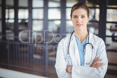 Portrait of confident female doctor with arms crossed