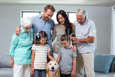 Family standing together with dog