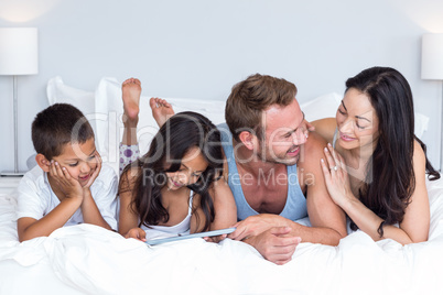 Happy family in their bedroom