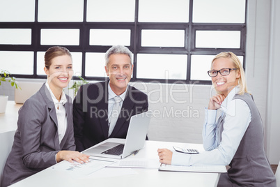 Portrait of business people with client